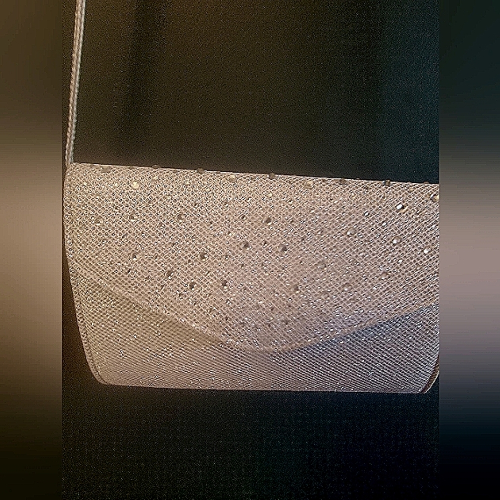 Sparkly/beaded clutch with rope strap. Like new.